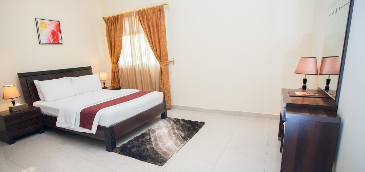 Tiger Home Hotel Apartments Muskat Bagian luar foto