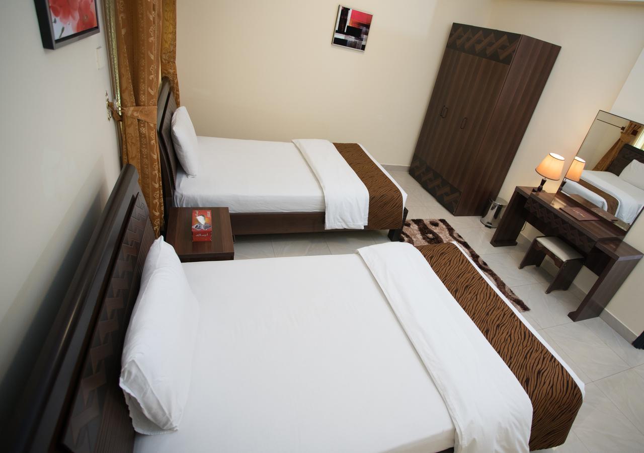 Tiger Home Hotel Apartments Muskat Bagian luar foto
