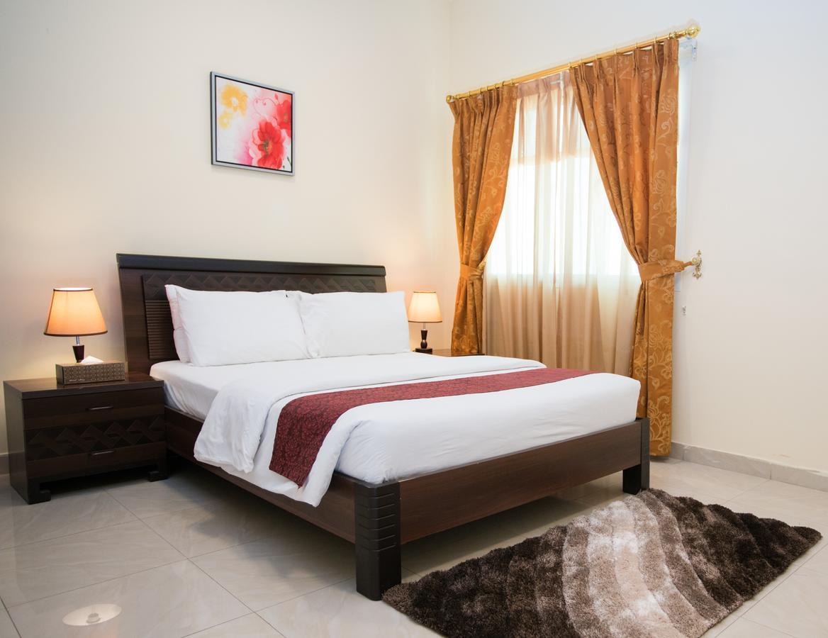 Tiger Home Hotel Apartments Muskat Bagian luar foto